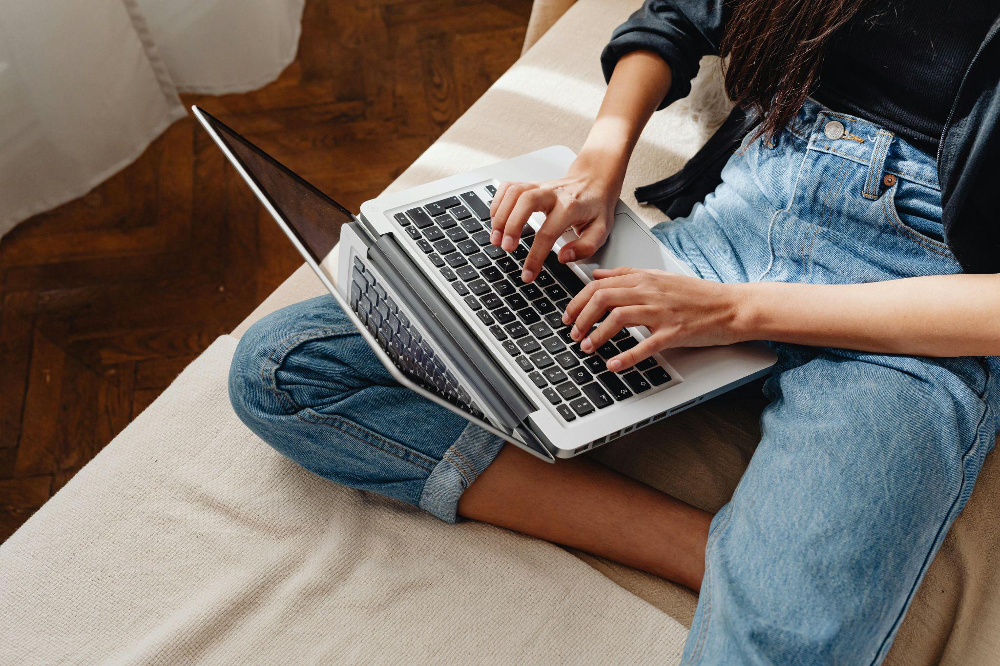 Person typing on laptop - WordPress hosting SEO features